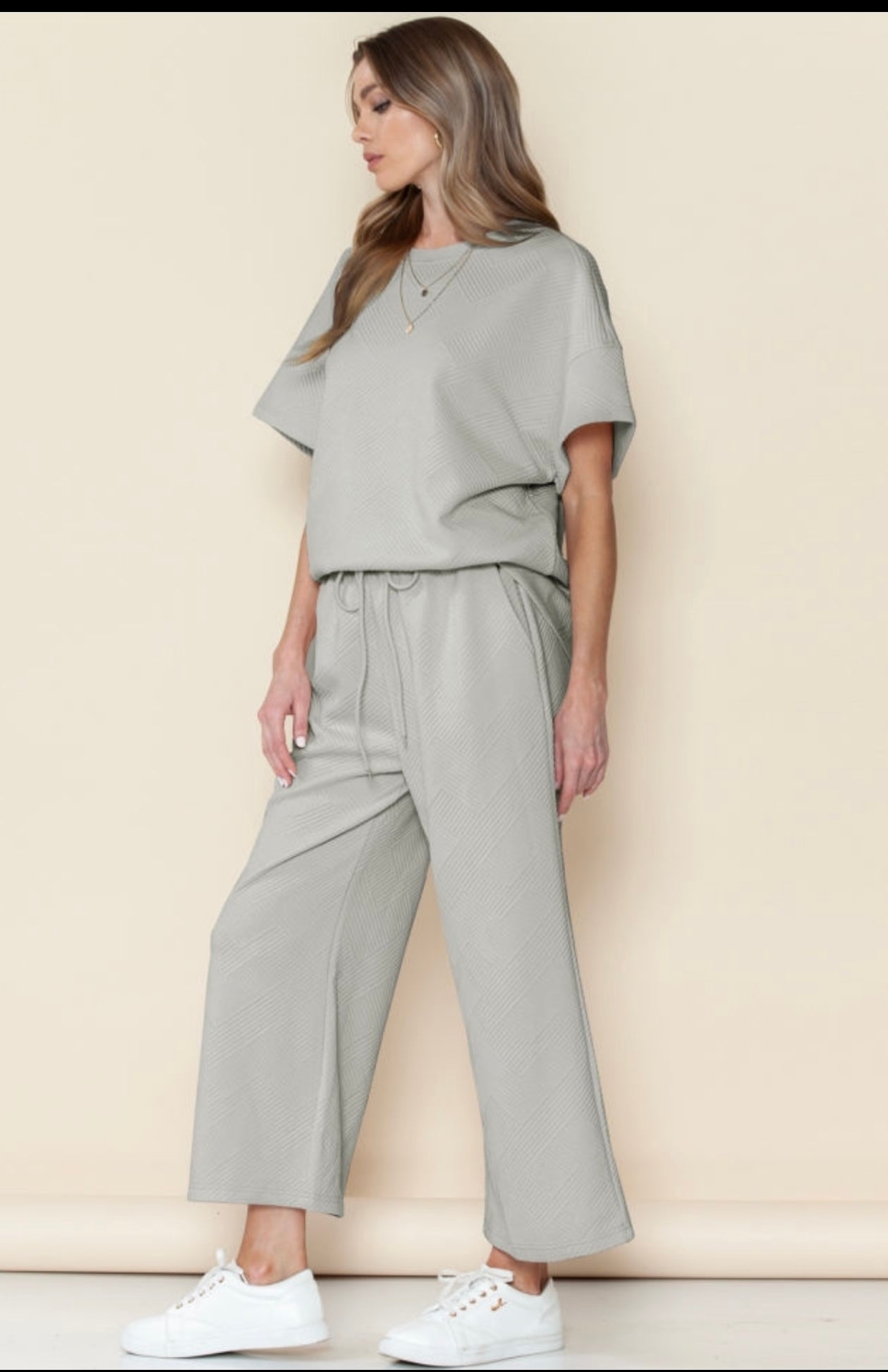 Gray textured loose fit T shirt and drawstring pants.