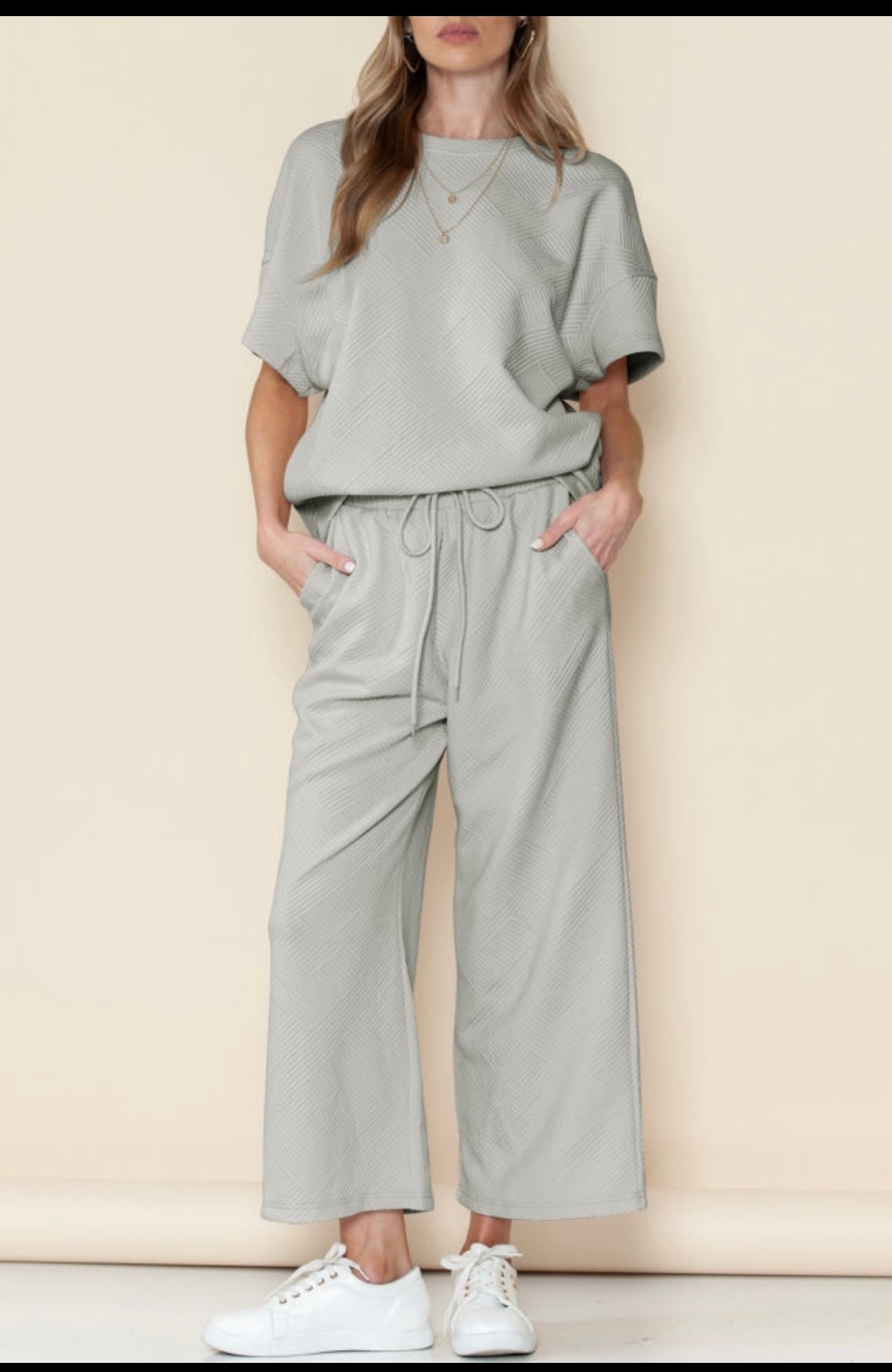 Gray textured loose fit T shirt and drawstring pants.